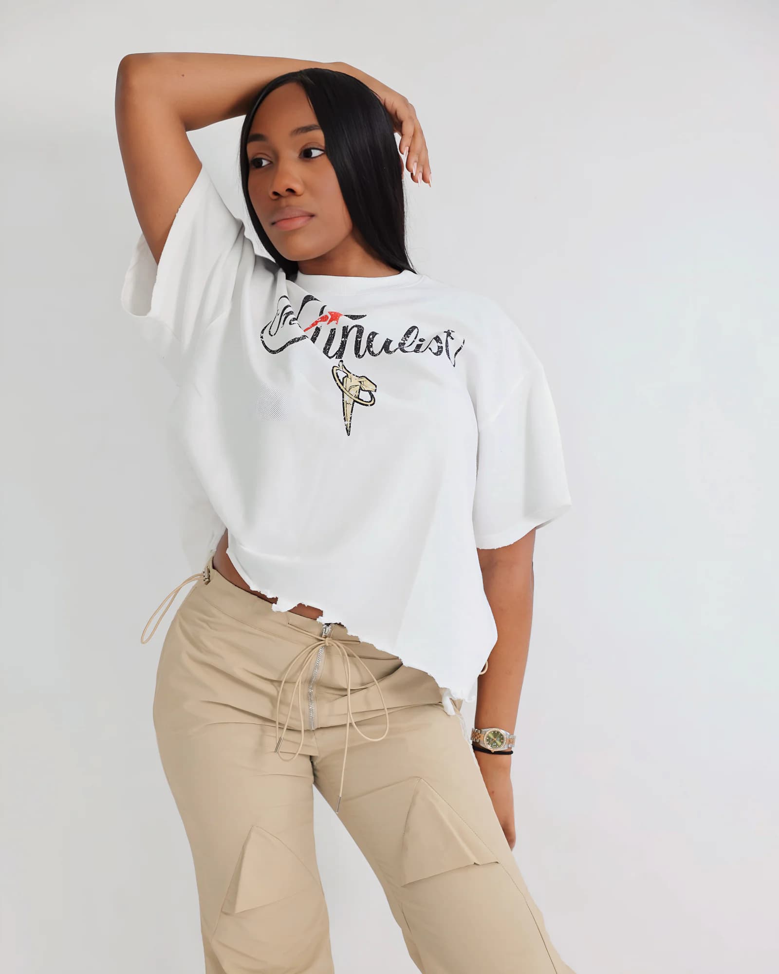 Model wearing the white PSRVE Finalist Tee in a close studio portrait